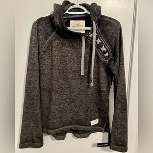 Women’s Hollister Black and Light Gray Long Sleeve Hooded shirt, size Medium.